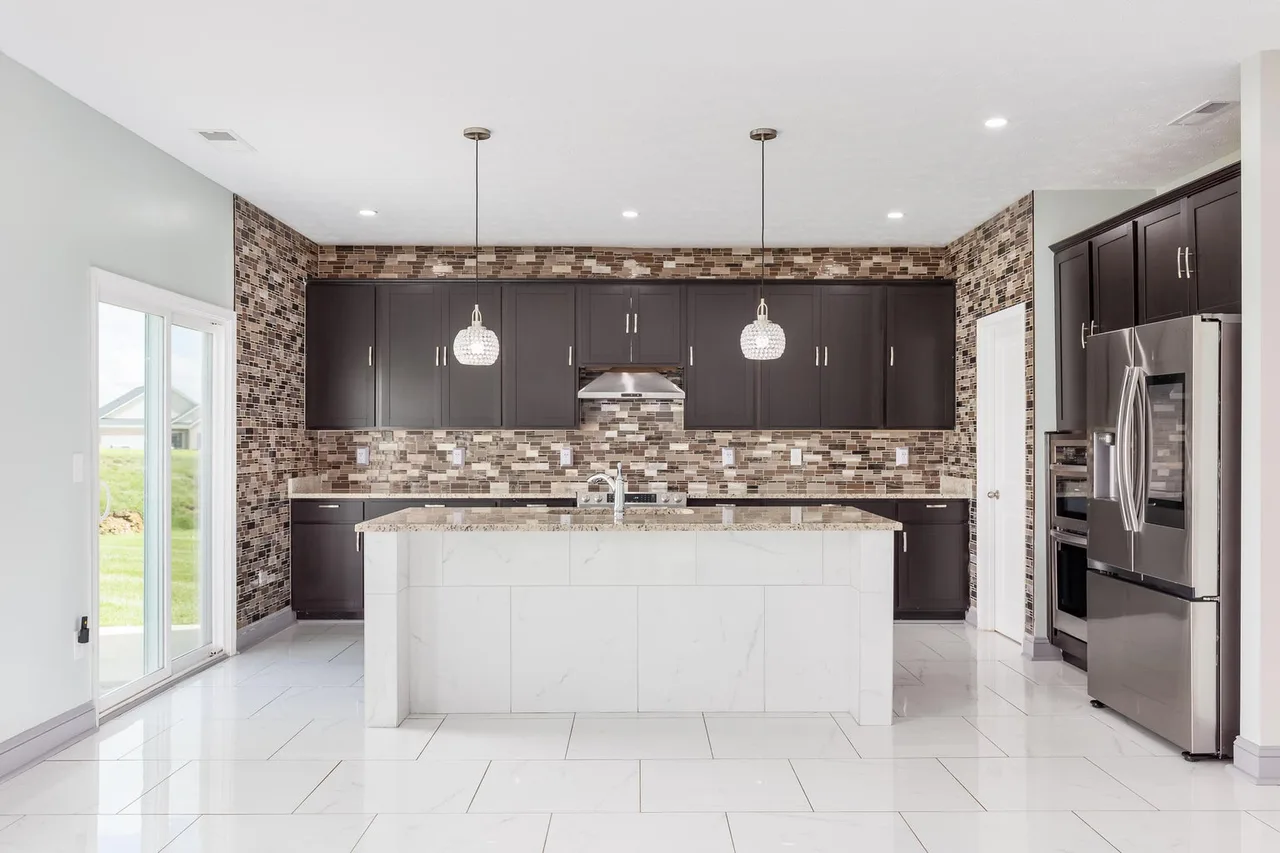 Modern kitchen with center island at 4266 Tingle Drive